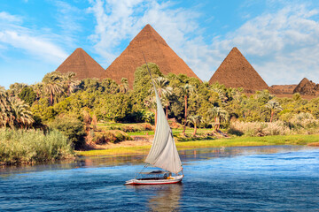 Beautiful Nile scenery with sailboat in the Nile on the way to pyramids, Egypt