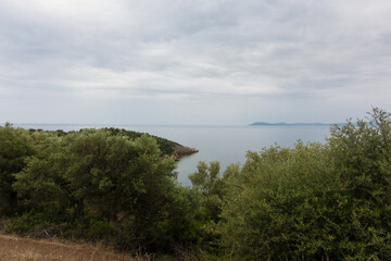 Stunning view to the sea from the hills around Toroni village, Chalkidiki, Greece, under a cloudy sky in autumn