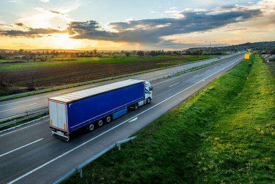 Large Transportation Truck on a highway road through the countryside