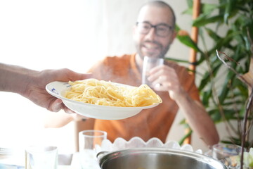 Happy man looking at Italian Spaghetti plate 