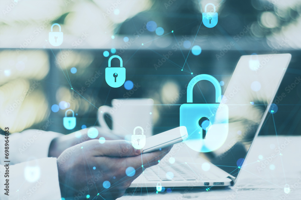 Poster Close up of man hands using laptop and cellphone at desk with low poly plexus digital padlock interface on blurry outdoor background. Safety, security, hacking and protection concept. Double exposure.