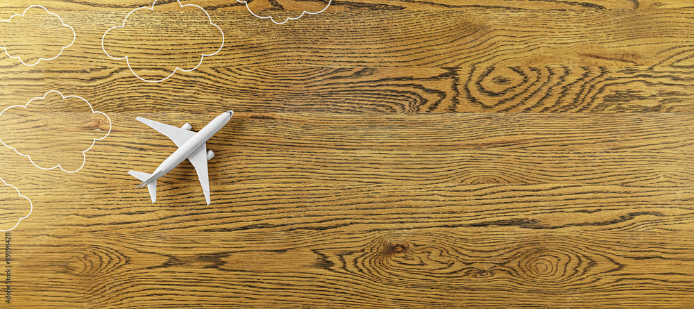 Poster Creative white airplane and drawn clouds on wide wooden background with mock up place. 3D Rendering.
