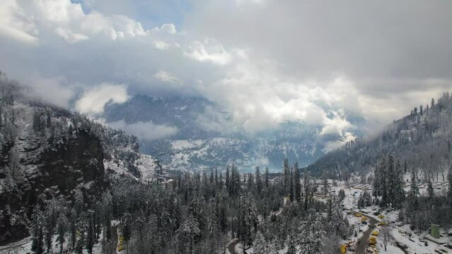 ITS A ARIEAL DRONE SHOTS OF ICE MOUNTAION AND ANOTHER MOUNTAION IN MANALI,INDIA
