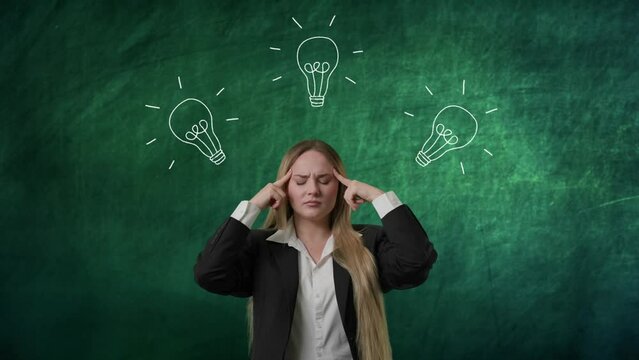 Portrait of woman isolated on green background light bulbs image on top. Girl standing thinking hard guessing choosing solutions, picks one lamp lights up.