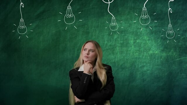 Portrait of woman isolated on green background light bulbs image on top. Girl standing thinking about ideas, wondering choosing best one, lamp lights up.
