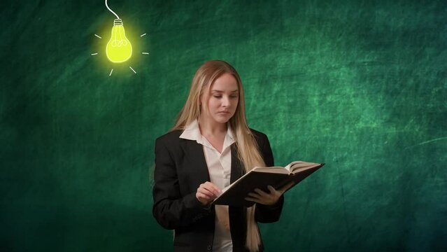 Portrait of woman isolated on green background light bulbs image on top. Girl standing flipping through book, smiling at camera, found ideas, lamp lights up.