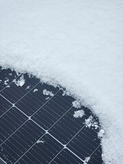Renewable energy solar PV panels covered with white snow.