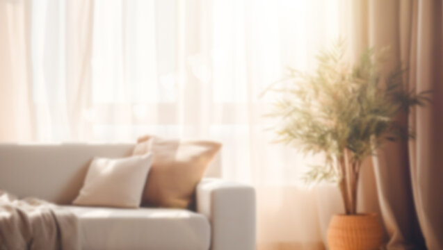 Blurred view of a living room interior with a sofa by the window.