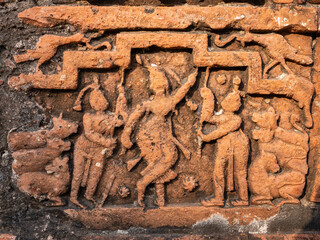 Detail of ancient terracotta relief depicting Krishna Govardhana hindi legend on exterior wall of Chauchala Chhota Govinda temple, Puthia, Bangladesh