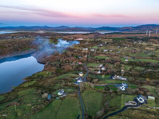 Smoke over Lough Fad due to traditionally burning of waste in rural Ireland - County Donegal