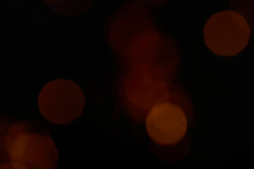 Beautiful red bokeh between black shadows.
