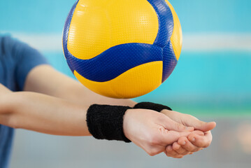 Close up of hands of a girl learning volleyball essential skills - digging. Volleyball female player practicing digging in volleyball game