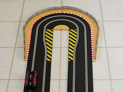 Hairpin bend on a slot car racing track. 