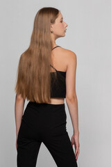 Fototapeta premium Blonde model girl with long hair in profile.