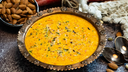 Carrot Kheer or payasam also known as Gajar ki Khir in a bowl, winter sweets kheer,