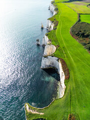 England, Beautiful aerial footage over the white cliffs, Old Harrys Rocks on the south coast of...