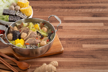 Delicious ginger duck hot pot soup with fresh vegetables in Taiwan.