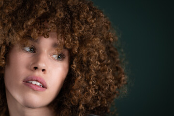 portrait of beautiful young curly woman