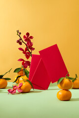 Pastel green surface featured a lot of tangerines and red envelopes. Chinese New Year is the...