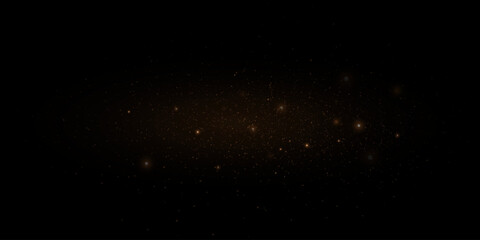 Golden glitter. Flare light effect. Shiny background of particles and light. Gold dust on a black background.