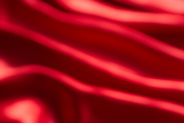 The bright red silk satin surface is beautiful and luxurious, wavy. For background and graphic work Blurry or blurry