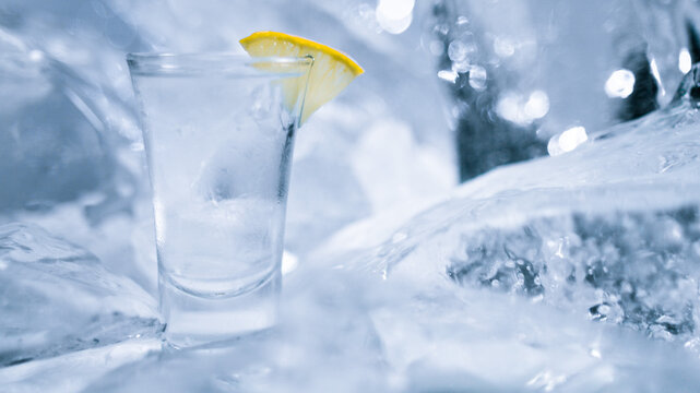 glass of vodka with lemon and ice