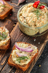 lard with herbs and bread toast on a wooden board. banner, menu, recipe place for text, top view