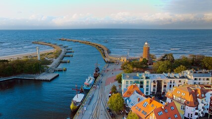 Aerial view of harbour and lighthouse in Kolobrzeg, Poland. Natural light, drone photography.