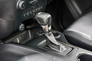 automatic transmission shift selector in the car interior. Closeup a manual shift of modern car gear shifter. 4x4 gear shift	