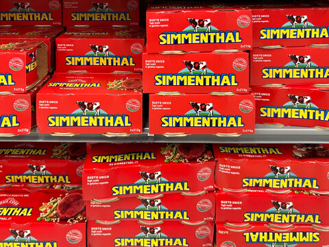 Italy - Dec. 24, 2023: Simmenthal canned meat packages displayed on shelf for sale in italian supermarket