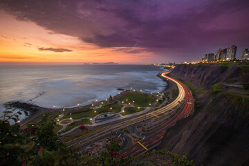 From the Malecón, you can witness the sun setting over the Pacific Ocean, casting a warm glow on...