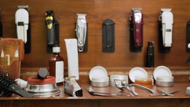 Top view barber tools on the shelf in the barbershop. High quality Full HD video