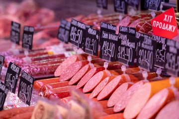 Sumy, Ukraine - December 21, 2023: Meat products store. Sausages on display at a grocery store.