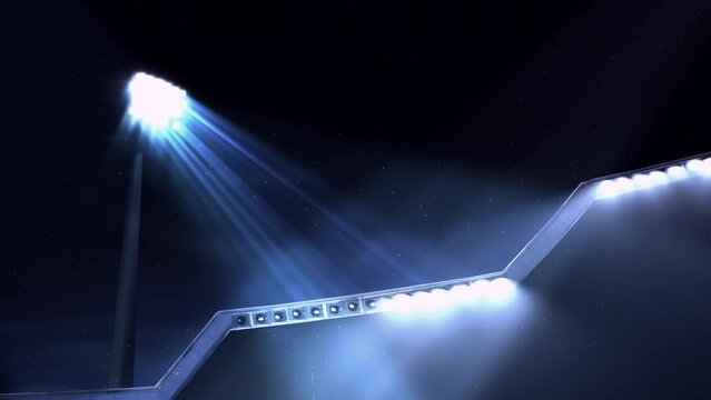 Stadium or arena lit up by lights and reflectors lighting up the bleachers