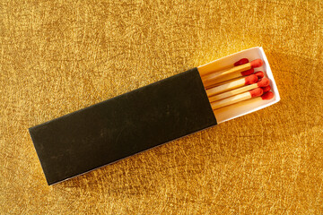 top view matchbox on a gold background