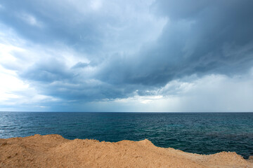 Looking at the sea from the coastal green area. Looking at the sea from the rocks on a cloudy day....