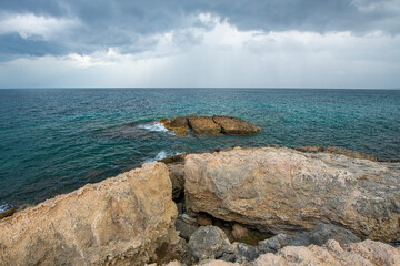 Looking at the sea from the coastal green area. Looking at the sea from the rocks on a cloudy day....