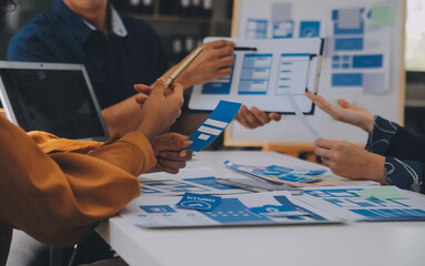 Close up ux developer and ui designer use augmented reality brainstorming about mobile app...