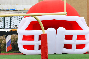 A Vibrant Inflatable Football Helmet on a Field