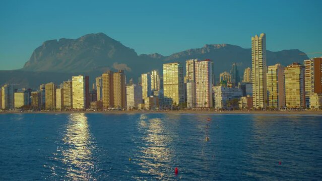 Establishing aerial view of Benidorm skyline skyscrapers hotels and resorts, Benidorm seaside coastline. Aerial view of skyscrapers and beach of the touristic city of Benidorm in the Spain