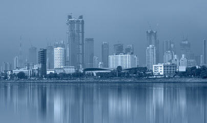 Mumbai is the financial and entertainment capital of India - Construction crane and skyscraper 