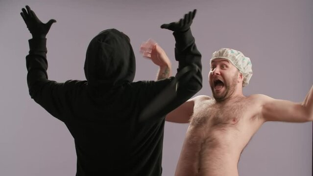 A maniac with a knife pulls back the shower curtain, intending to attack a man washing himself. The scream of the victim scares the maniac and drops the knife. A killer strangles a man .