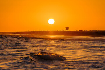 Beautiful sunset, full of the sun, amazing sunset on the Canary Island Fuerteventura, Spain.