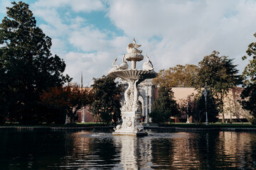 Fototapeta na wymiar White fountain with swans in Besiktas palace in Istanbul, Turkey.