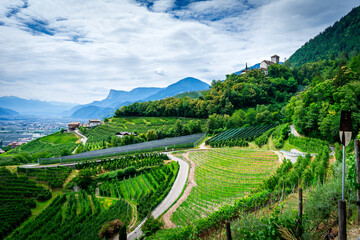 Hiking along the Marlinger Waalweg near Meran in South Tyrol Italy. With some Views over wineyards,...