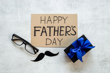 Greeting card concept flatlay for Happy Fathers day with gift box