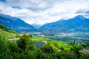 Fototapeta na wymiar Hiking along the Marlinger Waalweg near Meran in South Tyrol Italy. With some Views over wineyards, the City of Meran, Marling and other Villages