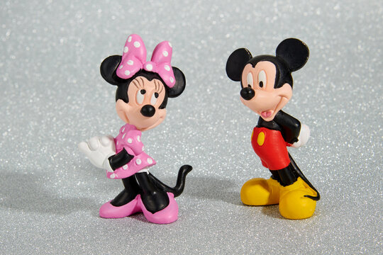 Colorful toy figures of cute Mickey Mouse and Minnie Mouse