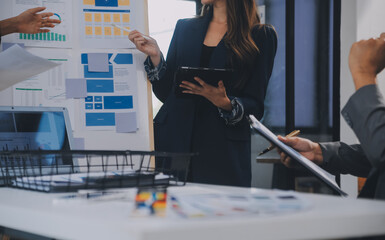 Close up ux developer and ui designer use augmented reality brainstorming about mobile app interface wireframe design on desk at modern office.Creative digital development agency