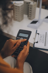 Electrical engineer with businessman discussing new project installation solar cell panel on the roof of building. Alternative energy concept.